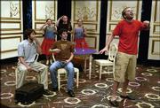 "She Stoops to Conquer" cast members, from left front, Brandon
DeLany as Charles Marlow, Andrew York as George Hastings, Phillip
Vocasek as Dick Hardcastle, and, back row from left, Julie
Maykowski, Josh Vignery and Katherine McRobbie as cupids rehearse.
The play, which opens Friday, wraps up University Theatre&squot;s summer
season.