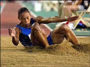 Marion Jones lands after her first jump in the women's long-jump
qualifying round at the U.S. Olympic track and field trials. Jones
on Monday advanced to Thursday's finals in the event in Sacramento,
Calif.