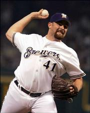 NL pitcher Dan Kolb of the Milwaukee Brewers pitches in the second
inning. Kolb pitched one shutout inning against the AL Tuesday in
Houston.