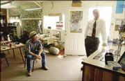 Bob Goodrow, Hays, left, sits in the Sport Haven Bait and Tackle
shop near the Cedar Bluff Reservoir while Rep. Jerry Moran talks
with the store's manager, Jeff Woodworth. Moran stopped at the shop
for bottled water.