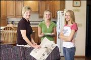 Robba Moran, wife of Congressman Jerry Moran, visits with their
daughters, Kelsey, 16, left, and Alex, 13, at their home in Hays.
Robba is a graduate of Duke University's law school and gave up
practicing and teaching law for motherhood and homemaking. She is
involved in many activities in Hays and is chairwoman of the Kansas
State Fair Board.