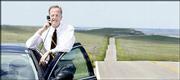 Kansas 1st District Congressman Jerry Moran stops his car on the
highest hill near Cedar Bluff Reservoir, about 25 miles south of
WaKeeney, hoping to get a better cell-phone connection. He was
checking in with his Washington, D.C., office as he hit the road
during the Independence Day congressional recess to visit his
western Kansas constituents. Kansas Highway 147, right, rolls
through Trego County.
