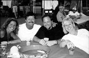 Brenda and Brett Meyers, left, and Russell and Camille Wheeler
attend "What Floats Your Boat." More than $12,000 was raised to
support Van Go Mobile Arts&squot; mission of job and life skills training
for disadvantaged youth ages 14-21. Russell Wheeler, owner of
Midwest Transportation, donated limousine service for the JAMS
teens for the event, which was June 12 at Clinton Lake Marina.