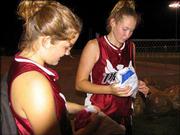 18-U Phenix players Jacqueline Pyle and Laura Drivetta open picture
frames given to them by by players from the Dakota Wild after an
11-1 loss in the opening round of pool play at the American
Fastpitch Assn. Naitonal "B" Tournament game July 19 at Clinton
Lake Sports Complex. All of the teams exchanged gifts representing
something about their team with their first opponent.