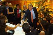 Donald Trump greets potential candidates for "The Apprentice" TV
reality show during the first day of auditions for next season.
Hundreds lined up Friday in New York to get a shot at being on the
show.