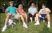 From left, Craig Davis, Sharon Davis, Judy Northway and Craig
Tucker attend The Big Pig, a fund-raiser for the Boys & Girls
Club of Lawrence. The event, which featured all-you-can-eat
barbecue and live music, was July 17 at the Meadowbrook apartment
complex, 15th Street and Crestline Drive.