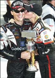 Devin Harvick, left, celebrates his win at the Brickyard 400 with
his wife, Delana. Harvick won the race Aug. 3, 2003, in
Indianapolis.