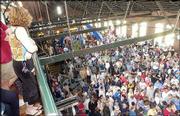 A crowd packs into Abe & Jake's Landing, 8 E. Sixth St., to
hear a speech by Democratic vice presidential candidate John
Edwards. Morning showers forced the Edwards appearance to an indoor
venue.