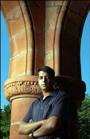 Ranjit Arab focuses his latest documentary, "El Jardin," on Kansas
politicians who support the federal No Child Left Behind Act but
want to refuse the children of undocumented workers the right to an
education. Arab, a publicist for the University Press of Kansas, is
pictured Thursday outside Spooner Hall on the Kansas University
campus.
