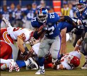 New York running back Ron Dayne breaks through the line for a
29-yard touchdown against Kansas City. Dayne finished with 11
carries for 118 yards and two scores in the Giants' 34-24 victory
Friday night at Giants Stadium in East Rutherford, N.J.