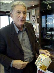 Bob Bernstein holds an original Happy Meal box at his
Bernstein-Rein Advertising Inc. office in Kansas City, Mo.
Bernstein, who was pictured Thursday, is the inventor of the Happy
Meal, which is 25 years old.