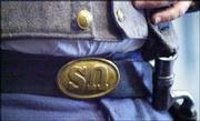 Denver Erickson, Topeka, wears a Civil War replica belt buckle
turned upside down to "SN" for South Nation instead of "US" for
United States. Erickson, a member of Sons of Confederate Veterans,
lectured Saturday afternoon at the Watkins Community Museum of
History, 1047 Mass., as part of the "Civil War on the Western
Frontier" program.