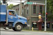 A truck approaches the "bump" in front of Johnny&squot;s Tavern in North
Lawrence, a road hazard that some claim has been there since the
late 1960s. While city officials say the dip actually is only about
a decade old, they agree it&squot;s been there long enough. The state has
agreed to help pay for repairs at the intersection in the next few
years.