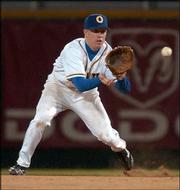 Omaha Royals second baseman Kevin Hooper, a Lawrence High product,
snags a bouncing grounder against the Albuquerque Isotopes on
Wednesday at Rosenblatt Stadium in Omaha, Neb.