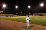 Lawrence native Kevin Hooper waits on deck for the Omaha Royals in
a game against the Albuquerque Isotopes. Now in his sixth pro
season, Hooper, who was 1-for-4 with a stolen base against his
former team this week at Rosenblatt Stadium in Omaha, Neb., still
is waiting for his chance to play major-league baseball.