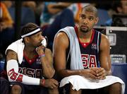 Allen Iverson, left, and Tim Duncan of the United States sit on the
bench during a men's basketball preliminary-round game against
Lithuania. The Americans lost, 94-90, Saturday at Hellinikon Indoor
Arena in Athens, Greece.