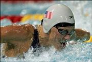 Jenny Thompson swims the butterfly leg of the women's medley relay.
Thompson won a silver medal -- the 12th Olympic medal of her career
-- Saturday in Athens, Greece.