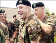 Army Reserve Sgt. Jared Myers, center, is congratulated by members
of the 418th Battalion after being awarded the Bronze Star for his
bravery in Iraq. Myers, 24, of Lawrence, received the medal for
actions after an attack on his convoy that left one passenger in
his Humvee dead and another critically wounded. The Sunday
afternoon recognition ceremony was at the former Richards Gebaur
Air Force Base in Belton, Mo.