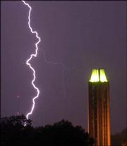 Lightning strikes near the Campanile on the Kansas University campus. Thunder storms struck Lawrence Monday night.