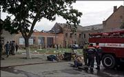 Soldiers, rescuers and police are seen at the school building
seized by militants in Beslan, North Ossetia. Commandos stormed a
school Friday in southern Russia where hundreds of hostages had
been held for three days, sending hostage-takers and their captives
fleeing in a scene of chaos amid explosions and gunfire. More than
100 children were wounded in the assault, some running from the
building naked and covered in blood.