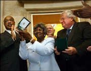 Viola Pearson, widow of Congressional Gold Medal winner Levi
Pearson, receives the award in his honor at the U.S. Capitol. The
awardees received the award Wednesday for their participation in
the Briggs v. Elliott court case, which was one of five cases
collectively known as Brown v. Board of Education.
