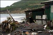 Damage caused by Hurricane Ivan is seen in the village of Dennery
on the coastline of Castries, Saint Lucia. The storm devastated
Grenada on Wednesday and is expected to hit Jamaica on Friday or
Saturday.