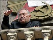 President of North Ossetia Alexander Dzasokhov speaks from a
balcony of a regional administration headquarters during a meeting
in the region's capital, Vladikavkaz. Dzasokhov said that the
regional government would step down within two days, the first sign
of officials being punished for last week's siege.