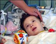 Azamat Mukagov, 20 months old, from Beslan, lies in a hospital bed
in a children's hospital in Moscow. Eight victims of the school
hostage crisis were receiving treatment at the hospital for burns
and gunshot wounds.