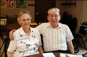 Doris and Ralph Sader, Lawrence, celebrate their 72nd wedding
anniversary. Residents of Babcock Place surprised the couple with
flowers before lunch Sept. 3 at the residence, 17th and
Massachusetts streets.
