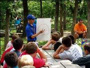 Tyler Thomas, of Boy Scout Troop 62, teaches a geology class at
Theodore Naish Scout Reservation near Bonner Springs. Tyler worked
this summer in the Nature Lodge at the reservation. He taught
classes to three sessions of Boy Scouts and 10 sessions of Webelos.