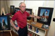 Frank Baron, professor of German at Kansas University, discusses
photographs of Lawrence's Sister City Eutin, Germany, that will be
on display this month at the Lawrence Public Library, 707 Vt. The
photo exhibition coincides with a visit by an Eutin delegation this
week.