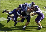 Kansas University quarterback Adam Barmann gets thrown for a loss
in the Jayhawks' 20-17 loss to Northwestern. Barmann was 30-for-48
for 294 yards in the loss Saturday in Evanston, Ill.
