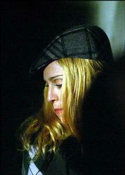 Pop star Madonna prays inside the tomb of Kabbalist Rabbi Yehuda
Ashlag, a Jewish mystic, during a visit in the Givat Shaul cemetery
in Jerusalem. Madonna, a Kabbalah devotee, is in Israel on a
five-day spiritual quest.