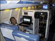 Pannirselvan Kanagaratnam, a Kansas University research associate
professor, works with radar equipment measuring ice sheet thickness
in Antarctica during a 2002 trip over the continent. Data from the
flight were used to determine that ice sheets are melting much more
quickly than originally thought.