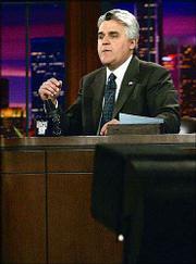 Jay Leno deadpans through telling a joke on the "Tonight" show in
this May 21, 2004, file photo at NBC&squot;s studios in Burbank, Calif.
The late-night king will step down in 2009, and NBC has offered
Conan O&squot;Brien the coveted time slot. Television insiders say the
early announcement was intended to circumvent the possibility
O&squot;Brien would be lured away by another network.