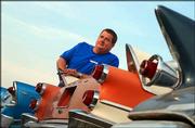 Keith Smith, president of H.Z. Smith Motors, earns his living by
selling antique cars. Smith, pictured Thursday at his car lot just
east of Lawrence on Kansas Highway 10, said he had noticed an
increase in sales during the past couple of years.