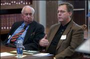 Howard Mossberg, left, dean emeritus of pharmacy at Kansas
University, and Tim Johnson, director of KU's Information and
Telecommunication Technology Center, participate in the Regional
Bioscience and Innovation Summit. The summit was Monday at the Dole
Institute of Politics.