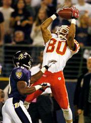 Kansas City wide receiver Johnnie Morton, right, makes a grab over
Baltimore cornerback Raymond Walls. The Chiefs defeated the Ravens,
27-24, Monday in Baltimore.