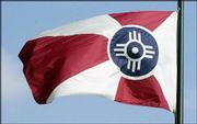 The official city flag of Wichita flies next to Wichita City Hall.
The flag was ranked among the nation's best city flags in a recent
poll.