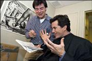 Stewart Bailey, Kansas University alum and co-executive producer of
"The Daily Show," goes over a script with on-air correspondent
Stephen Colbert, right.