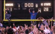 Kansas University fans tear down the goal post at the south end of
Memorial Stadium after KU's defeat of Kansas State University. The
KU victory Saturday was the first over the Wildcats in football
since 1992.