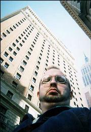 Journal-World reporter Joel Mathis takes a slightly misaligned shot
of himself with the Empire State Building, on the right. Mathis was
in New York Oct. 1-3 for the annual New Yorker Festival.