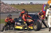 Tony Stewart's pit crew works on a stop during the NASCAR Busch
Series Mr. Goodcents 300. Joe Nemechek won the race Saturday at
Kansas Speedway in Kansas City, Kan.