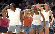 Kansas women players Jaclyn Johnson, left, Selena Scott and Brooke
Reves participated in a skit during the 2000 Late Night.