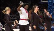 Bewigged former Kansas standout Kenny Gregory boogies with the
Crimson Girls during a Late Night extravaganza.