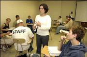 Shannon Portillo, 20, a Kansas University graduate student, teaches
a Western civilization class. Portillo has already graduated from
KU with undergraduate degrees in political science and
international studies.