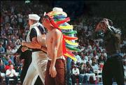 John Crider, left, Jeff Boschee, middle, and Terry Nooner
lipsynched a "Village People" number in a musical endeavor at Late
Night.