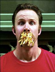 Morgan Spurlock, the director/star of "Super Size Me," will relate
his experiences battling McDonald&squot;s while in Lawrence on Monday.