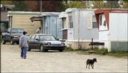 Larry Midyett, owner of Century 21 Miller & Midyett Real
Estate, plans to redevelop this trailer park at 1045 E. 23rd St. He
plans to build an office building that would house his real estate
company on the four-acre property, which was pictured Tuesday. The
project would require several trailers on the site to be relocated.