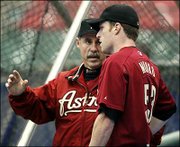 Houston manager Phil Garner, left, talks with Peter Munro, the
Astros' starting pitcher for Game 6 tonight. The Astros, who worked
out Tuesday at Busch Stadium in St. Louis, lead the Cardinals in
the NL championship series 3-2.